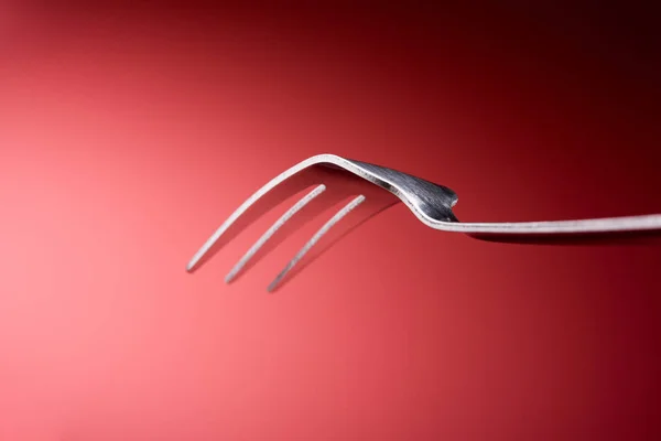 Fork in red background, Horizontal — Stock Photo, Image