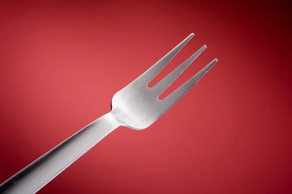 Fork in red background, Horizontal — Stock Photo, Image