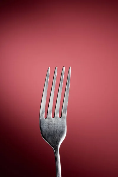 Fork in red background — Stock Photo, Image