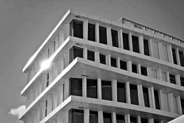 Modern building. Modern office building with facade of glass. Black and white — Stock Photo, Image