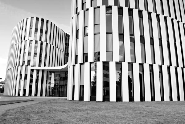 Modern building. Modern office building with facade of glass. Black and white — Stock Photo, Image