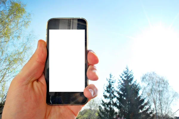 Mockup immagine di mano che tiene il telefono cellulare nero — Foto Stock