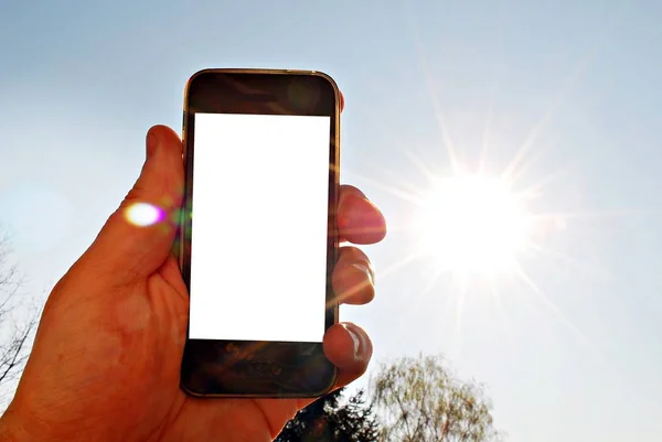 Mockup image of hand holding black mobile phone — Stock Photo, Image