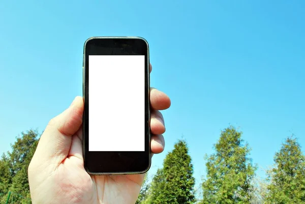 Mockup image of hand holding black mobile phone — Stock Photo, Image