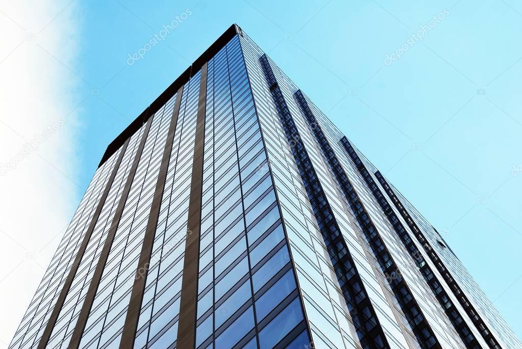 Tall apartment buildings on blue sky background