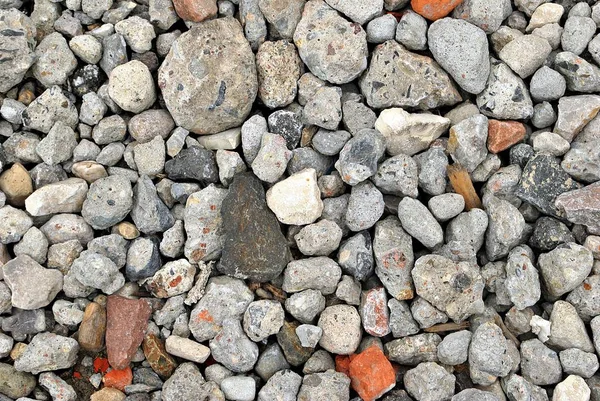 Pedra cinzenta esmagada no fundo da textura do solo — Fotografia de Stock