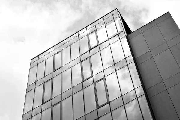 Modern building.Modern office building with facade of glass. Black and white. — Stock Photo, Image