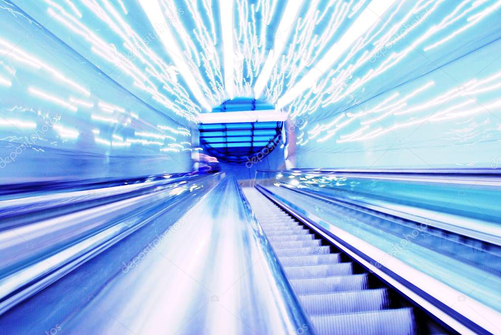 Blurred backround of moving futuristic escalator. Blurred image.