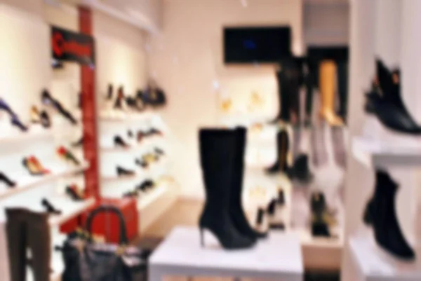 Bokeh světlé pozadí v obchodě s obuví. — Stock fotografie