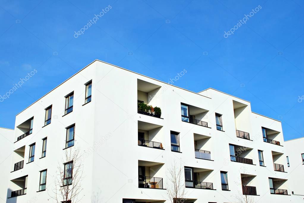 Modern apartment buildings on a sunny day with a blue sky