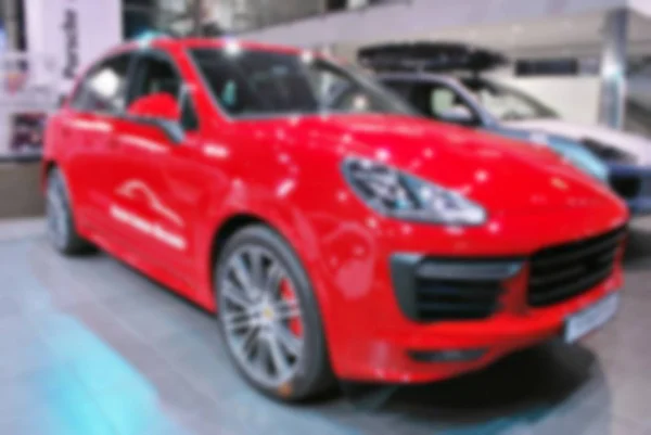 Blur image of car in the showroom use for background — Stock Photo, Image