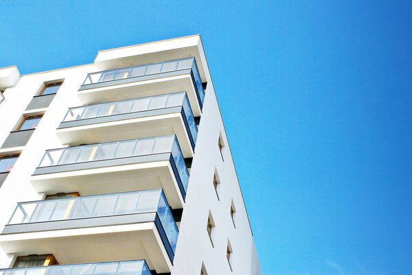 Modern apartment buildings on a sunny day with a blue sky. 