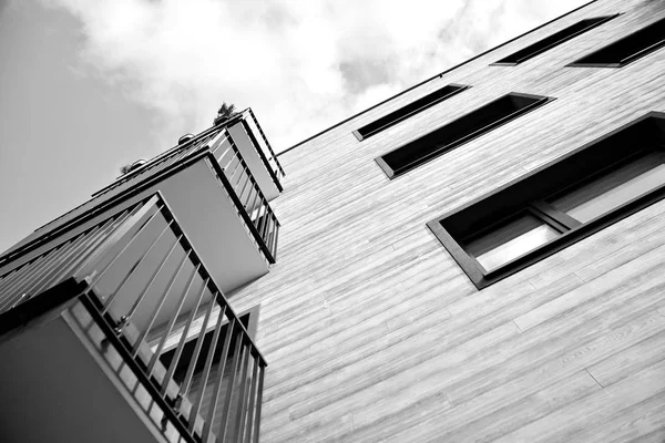 Facade of a modern apartment building. Black and white