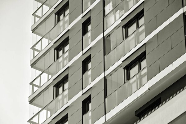 Facade of a modern apartment building. Black and white