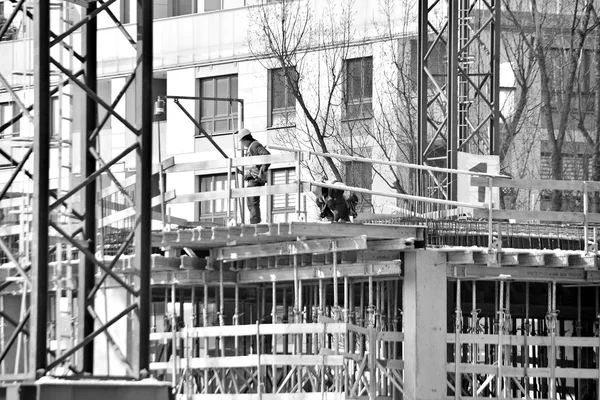 construction site workers, black and white