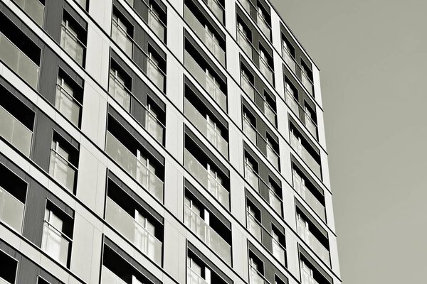 Detail of a new modern apartment building. Black and white.