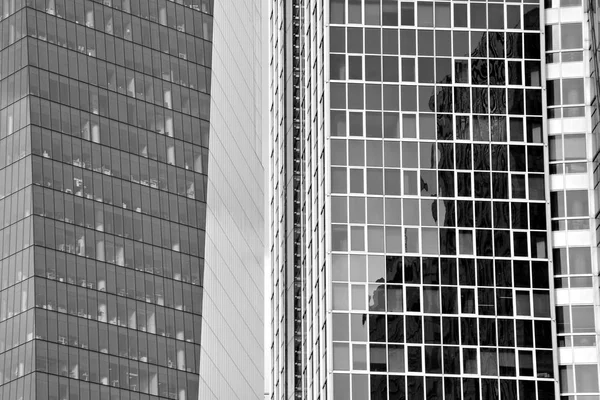 Glass walls of a office building - business background. Black and white.