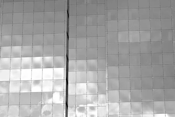 Glass walls of a office building - business background. Black and white.