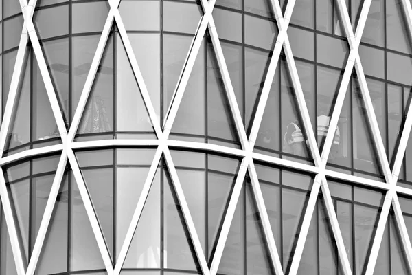 Glass walls of a office building - business background. Black and white.