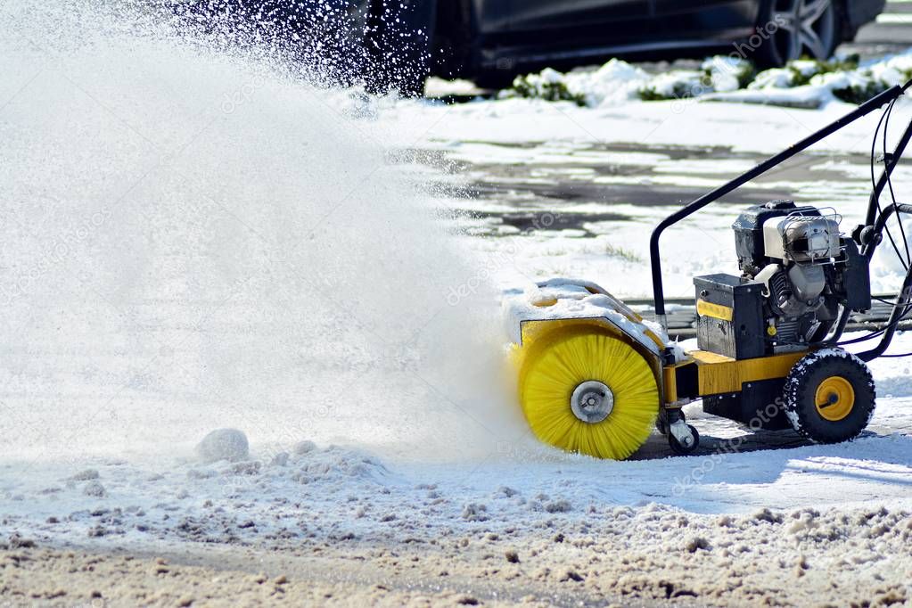Removing the snow by snow blower
