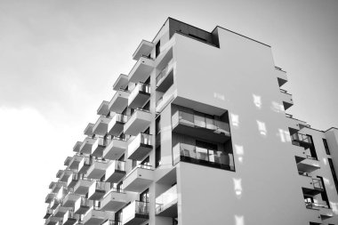 Modern and new apartment building. Multistoried, modern, new and stylish living block of flats. Black and white.