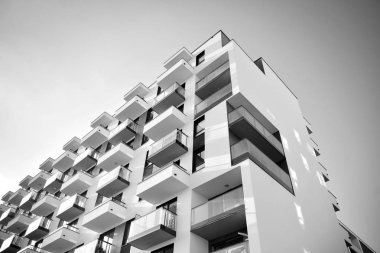 Modern and new apartment building. Multistoried, modern, new and stylish living block of flats. Black and white.
