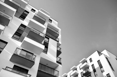 Modern and new apartment building. Multistoried, modern, new and stylish living block of flats. Black and white.