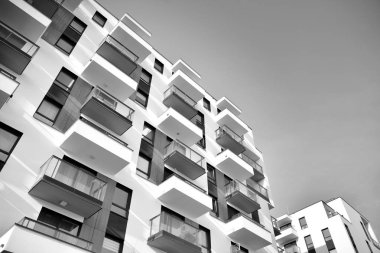 Modern and new apartment building. Multistoried, modern, new and stylish living block of flats. Black and white.