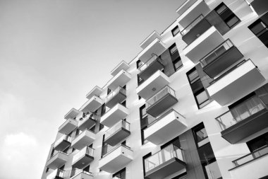 Modern and new apartment building. Multistoried, modern, new and stylish living block of flats. Black and white.
