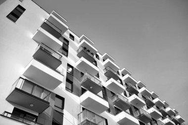 Modern and new apartment building. Multistoried, modern, new and stylish living block of flats. Black and white.