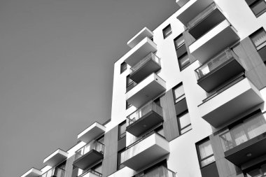 Modern and new apartment building. Multistoried, modern, new and stylish living block of flats. Black and white.