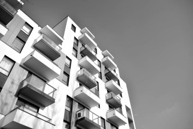 Modern and new apartment building. Multistoried, modern, new and stylish living block of flats. Black and white.