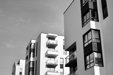 Modern and new apartment building. Multistoried, modern, new and stylish living block of flats. Black and white.