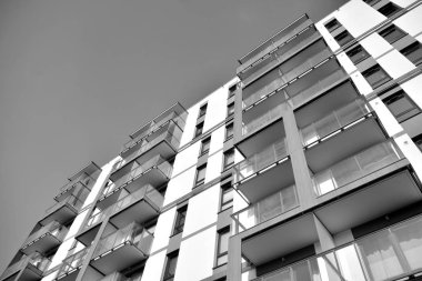 Modern and new apartment building. Multistoried, modern, new and stylish living block of flats. Black and white.