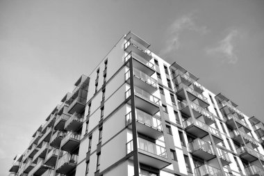 Modern and new apartment building. Multistoried, modern, new and stylish living block of flats. Black and white.