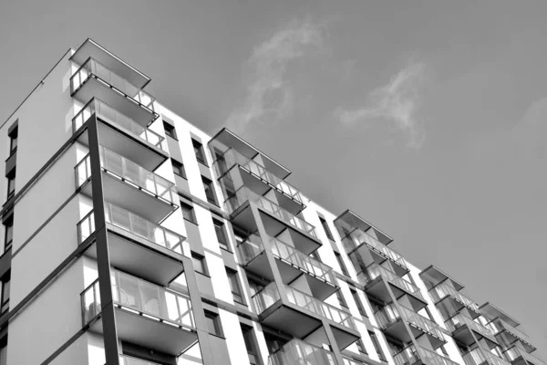 Modern and new apartment building. Multistoried, modern, new and stylish living block of flats. Black and white.