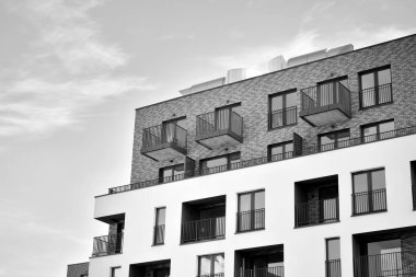Modern and new apartment building. Multistoried, modern, new and stylish living block of flats. Black and white.