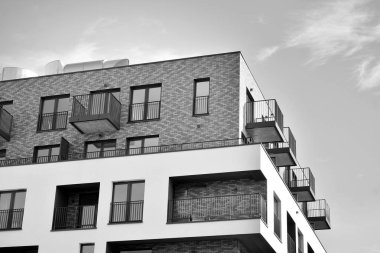 Modern and new apartment building. Multistoried, modern, new and stylish living block of flats. Black and white.