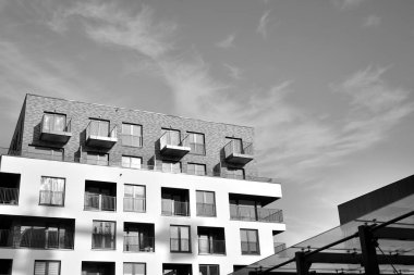 Modern and new apartment building. Multistoried, modern, new and stylish living block of flats. Black and white.