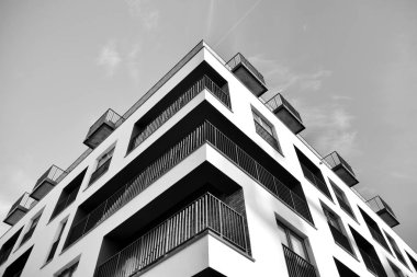Modern and new apartment building. Multistoried, modern, new and stylish living block of flats. Black and white.