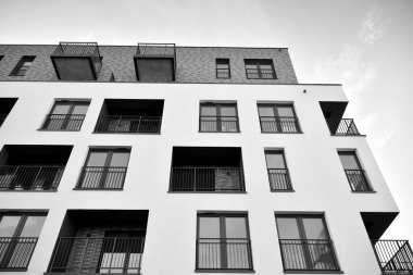Modern and new apartment building. Multistoried, modern, new and stylish living block of flats. Black and white.