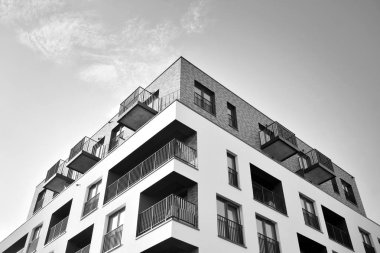 Modern and new apartment building. Multistoried, modern, new and stylish living block of flats. Black and white.