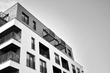Modern and new apartment building. Multistoried, modern, new and stylish living block of flats. Black and white.