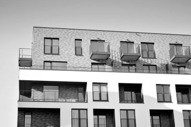 Modern and new apartment building. Multistoried, modern, new and stylish living block of flats. Black and white.