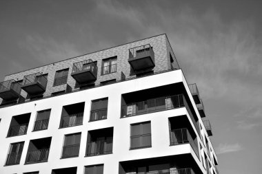Modern and new apartment building. Multistoried, modern, new and stylish living block of flats. Black and white.