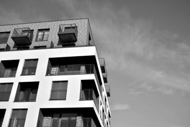 Modern and new apartment building. Multistoried, modern, new and stylish living block of flats. Black and white.