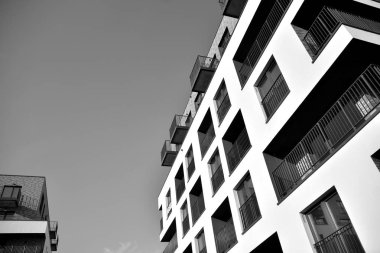 Modern and new apartment building. Multistoried, modern, new and stylish living block of flats. Black and white.