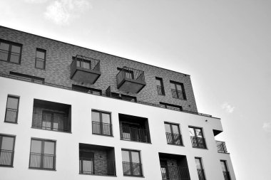 Modern and new apartment building. Multistoried, modern, new and stylish living block of flats. Black and white.