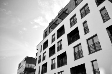 Modern and new apartment building. Multistoried, modern, new and stylish living block of flats. Black and white.
