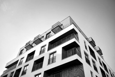 Modern and new apartment building. Multistoried, modern, new and stylish living block of flats. Black and white.